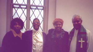 Rev Young after ordination with mother and pastors
